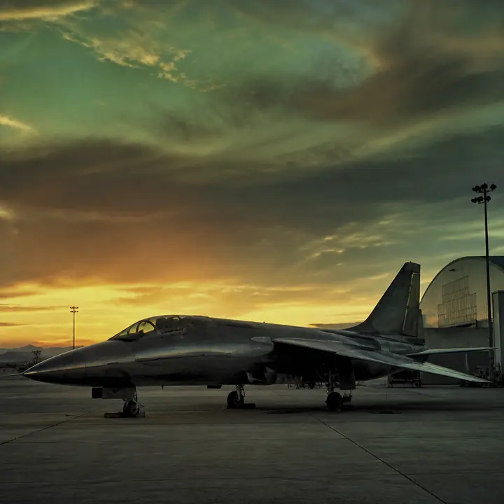 A 1990s desert airbase under a green-gold sky